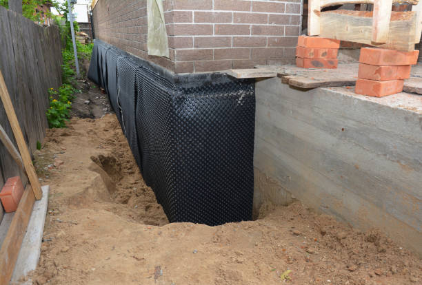 Happy homeowners after waterproofing job in New Bavaria